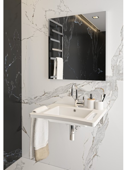 Vasque blanc fixé au mur d'une salle de bain sous un miroir mural